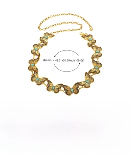 Detail of gold butterfly waist chain with turquoise gems and measurements