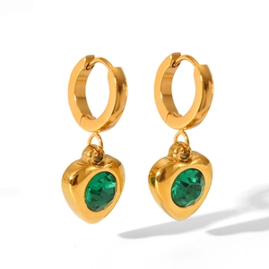 Detail of 18K gold stainless steel earrings with heart-cut green zircon pendants