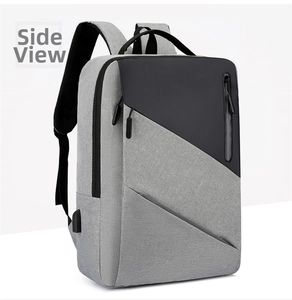 Side view of gray and black business laptop backpack showing USB port and padded straps