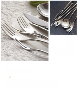Close-up of mirror-polished stainless steel cutlery set with slender handles