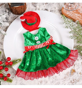 Detail of Christmas elf bottle topper with green sequin dress and red pointed hat