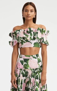 Detail of ruffled bandeau bikini top and matching hydrangea print skirt for women
