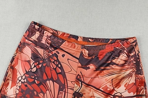 Detail of elastic waistband and butterfly wing print on vintage women's trousers