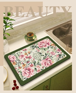 Macro detail of quick-dry floral absorbent mat with non-slip texture on a kitchen counter