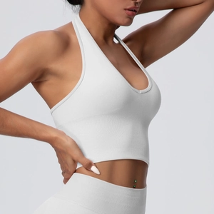 Detailed side view of white halter yoga bra showing breathable ribbed seamless fabric