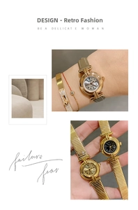 Close-up of elegant ladies' round dial watch with vintage Roman numerals and gold case