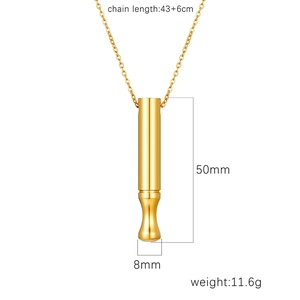 Golden mindfulness breathing whistle necklace with size dimensions on white background