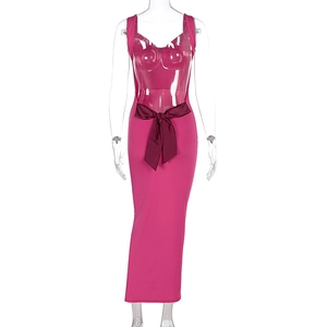 Detail of sexy backless maxi dress in pink with a burgundy bow and slim fit silhouette