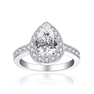 Detail of pear-cut halo wedding ring with micro-paved diamonds and silver finish