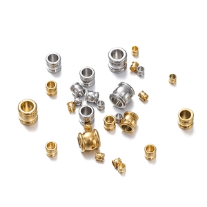 Macro view of gold and silver cylinder beads in various sizes for DIY jewelry making