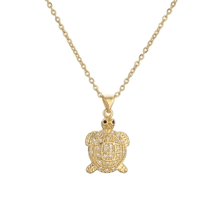 Golden tortoise pendant necklace featuring sparkling cubic zirconia and intricate shell details