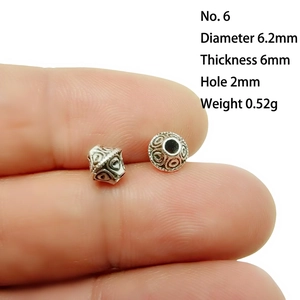 Detailed view of No.6 antique silver alloy spacer bead with 6.2mm diameter and 2mm hole