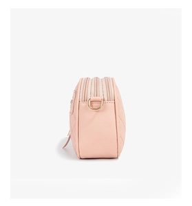 Side view of pink quilted PU leather camera bag featuring three zippers and gold D-rings