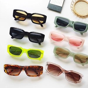 Flat lay of retro square sunglasses in multiple colors on a clean white background
