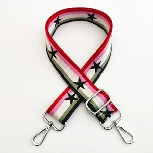 Adjustable wide knitted bag strap with colorful stripes and black star patterns