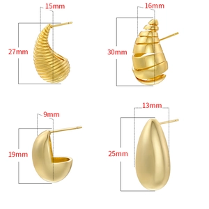 Macro display of gold vintage hollow spiral and teardrop stud earrings with dimensions