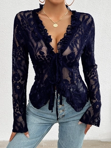 Close-up of dark blue lace long sleeve top with V-neck and delicate tie-up ribbon detail