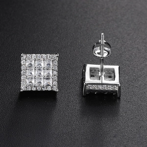 Macro detail of square iced-out earrings with screw back and cubic zirconia stones