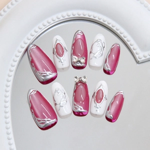 Y2K style silver bow press-on nails with purple cat eye design and 3D metallic accents