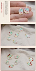 Detail of 3D resin cherry pendants with gold loops for DIY jewelry making and crafts