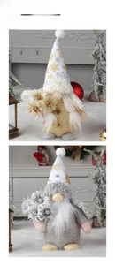 Standing faceless Christmas gnomes in gold and silver outfits with snowflake pattern hats