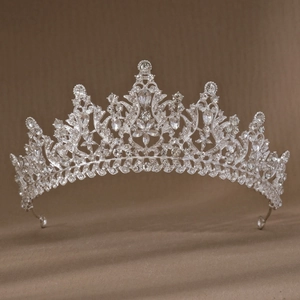 Macro shot of silver bridal tiara showing intricate rhinestone settings and luxury details