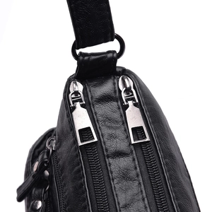 Classic black washed leather shoulder bag with durable silver zipper details for women