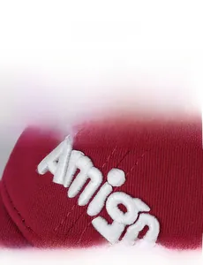 Detailed close-up of premium 3D Amigo embroidery on wine red washed cotton baseball cap