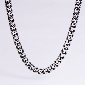 Macro shot of antique silver stainless steel cuban chain with oxidized vintage finish