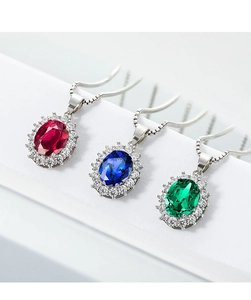 Detailed view of red, blue, and green oval sapphire sunflower pendants on white steps