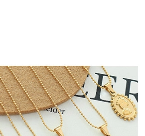 Close-up of a 18K gold plated oval coin pendant necklace featuring vintage portrait relief
