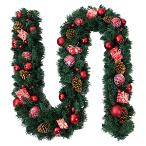 Christmas pine garland with red ornaments, pine cones, and gift boxes on white backdrop