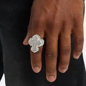 Men's hip hop silver cross ring with pavé zircons worn on hand, bold streetwear style