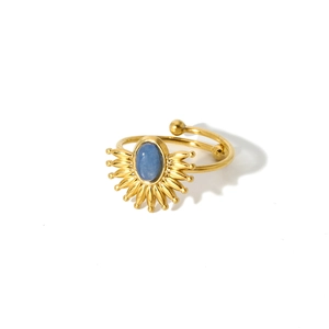 Detail of 18k gold plated sunburst ring with oval blue gemstone and adjustable band