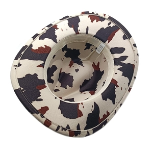Detail view of polyester western cowboy hat interior showing the label and black cow print