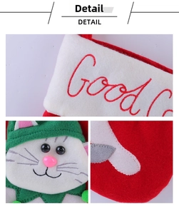 Dettaglio della calza di Natale in feltro con ricamo gatto e decorazioni in rilievo 3D