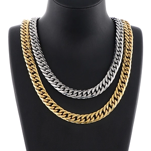 Bold hip-hop Cuban link necklaces in gold and silver finish shown on a black bust