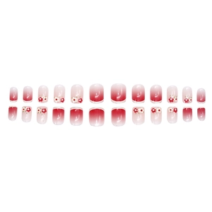 Short square pink ombré press-on nails with delicate red and white floral patterns