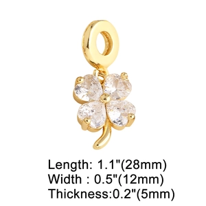 Detail showing dimensions of a gold clover pendant with heart-shaped zircon stones