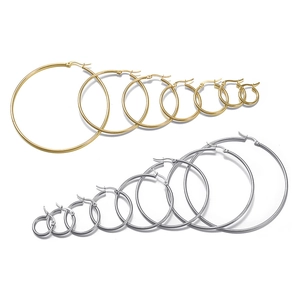 Set of gold and silver stainless steel hoop earrings in various sizes on white background