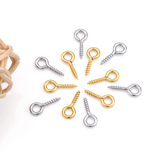 Gold and silver stainless steel eye pins for DIY jewelry making in circular layout
