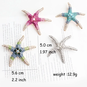 Detailed view of colorful rhinestone starfish brooches in multiple ocean colors