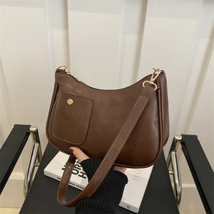 Vintage brown leather shoulder bag with a small pocket and minimalist square design