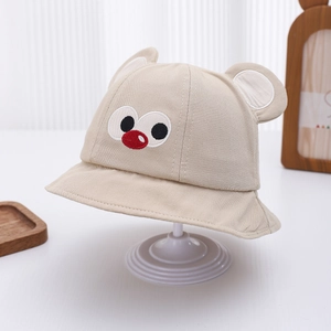 Detail of baby beige bucket hat with cute 3D ears and cartoon embroidery for sun protection