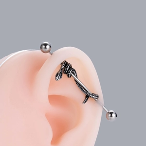 Industrial barbell piercing in stainless steel featuring a vintage snake wrap design