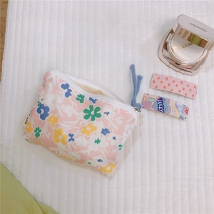Detail of floral cotton mini pouch with zipper for coins, earphones and small cosmetics