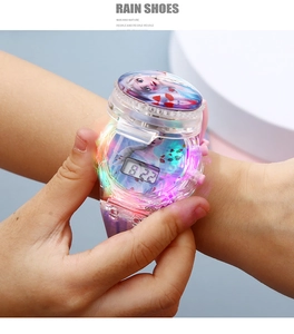 Detail of glowing digital watch featuring Frozen Elsa design with rainbow LED light effect