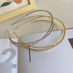 Detail of gold and silver crossover headbands featuring delicate rhinestone inlay work