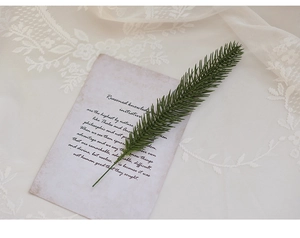 Detailed view of artificial green pine needle branch for Christmas tree floral decor