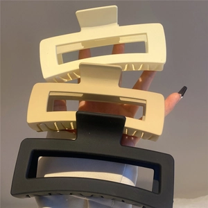 Three matte square hair claws in beige, apricot, and black colors for elegant styling